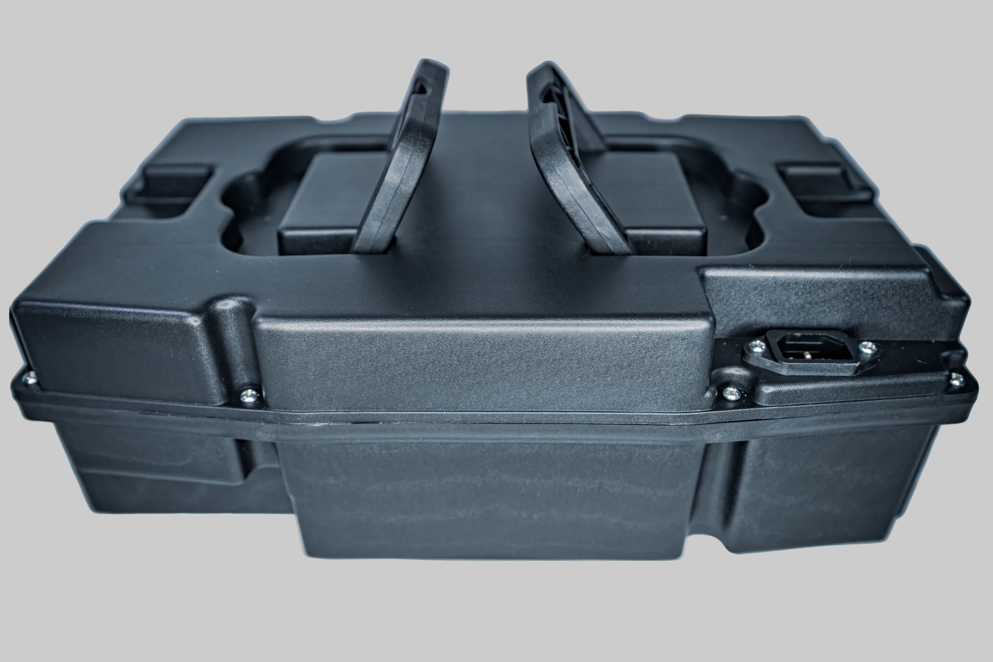 Black portable storage case with handles on a white background